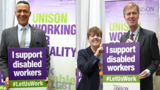 Clive Lewis MP and Sir Stephen Timms holding 'I support disabled workers' at UNISON event